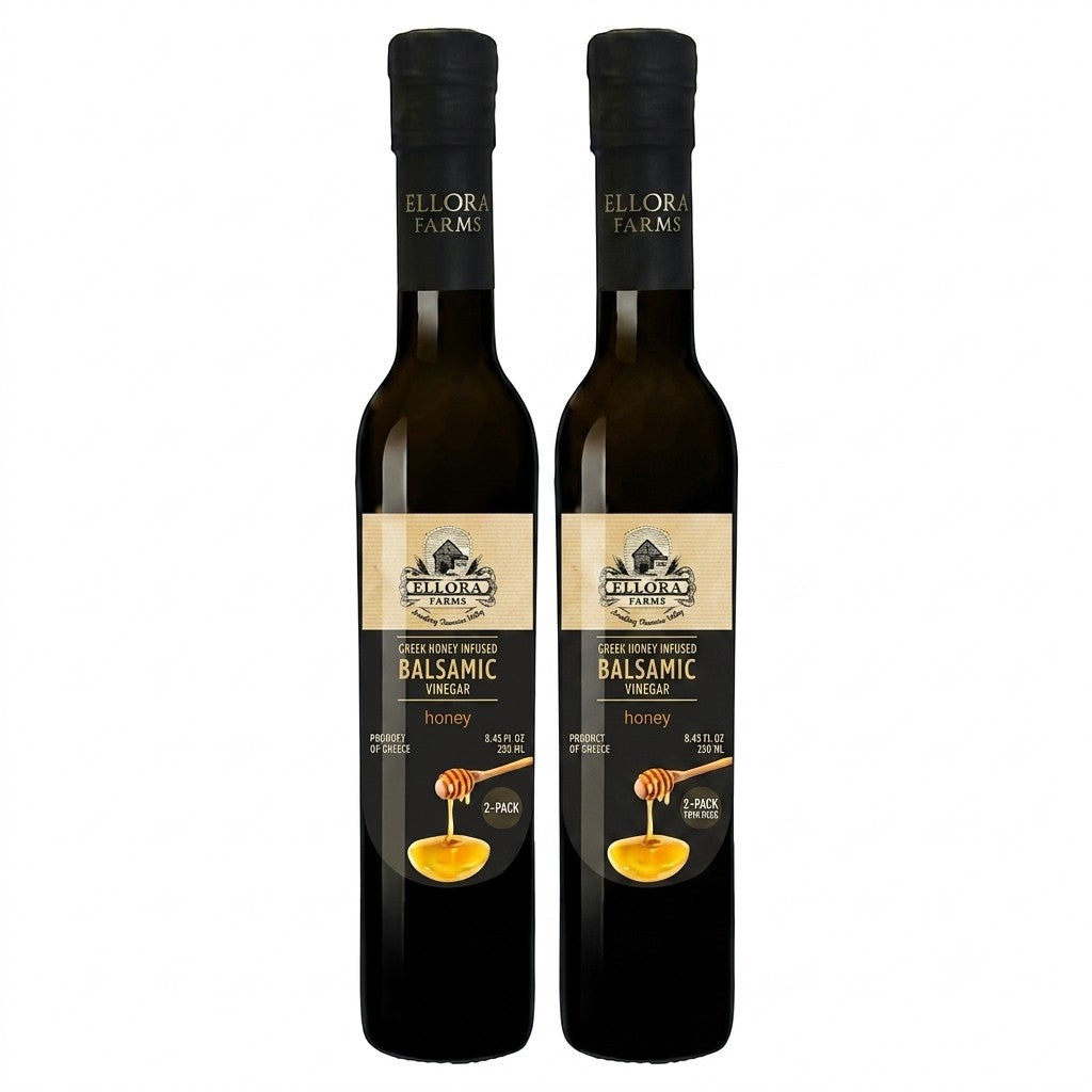 Two bottles of ELLORA FARMS Greek honey infused balsamic vinegar with a honey dipper graphic on the label.