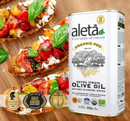 ELLORA FARMS Aleta organic PDO extra virgin olive oil 1L tin next to bruschetta with tomatoes and cheese